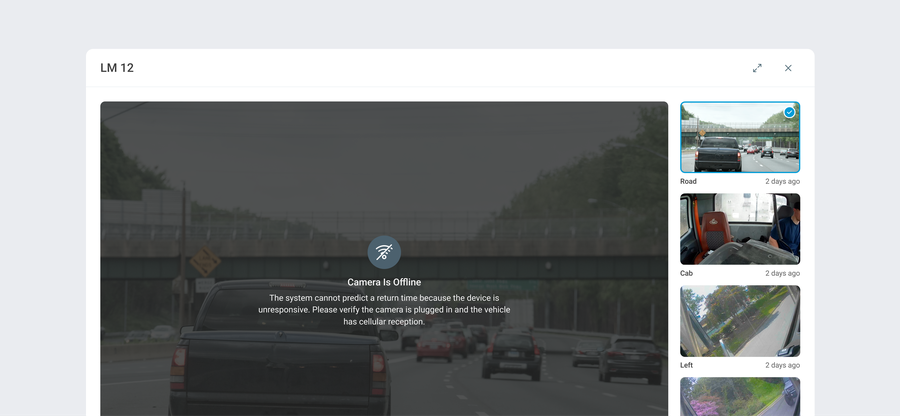 A vehicle camera window showing the Camera Is Offline message over the last snapshot, with the camera list alongside